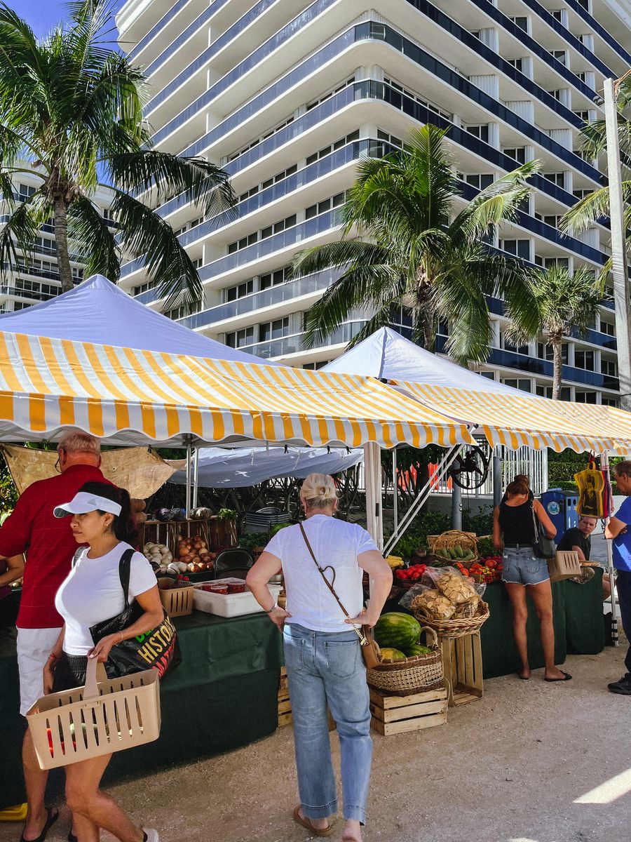 Shoppers at a produce stand